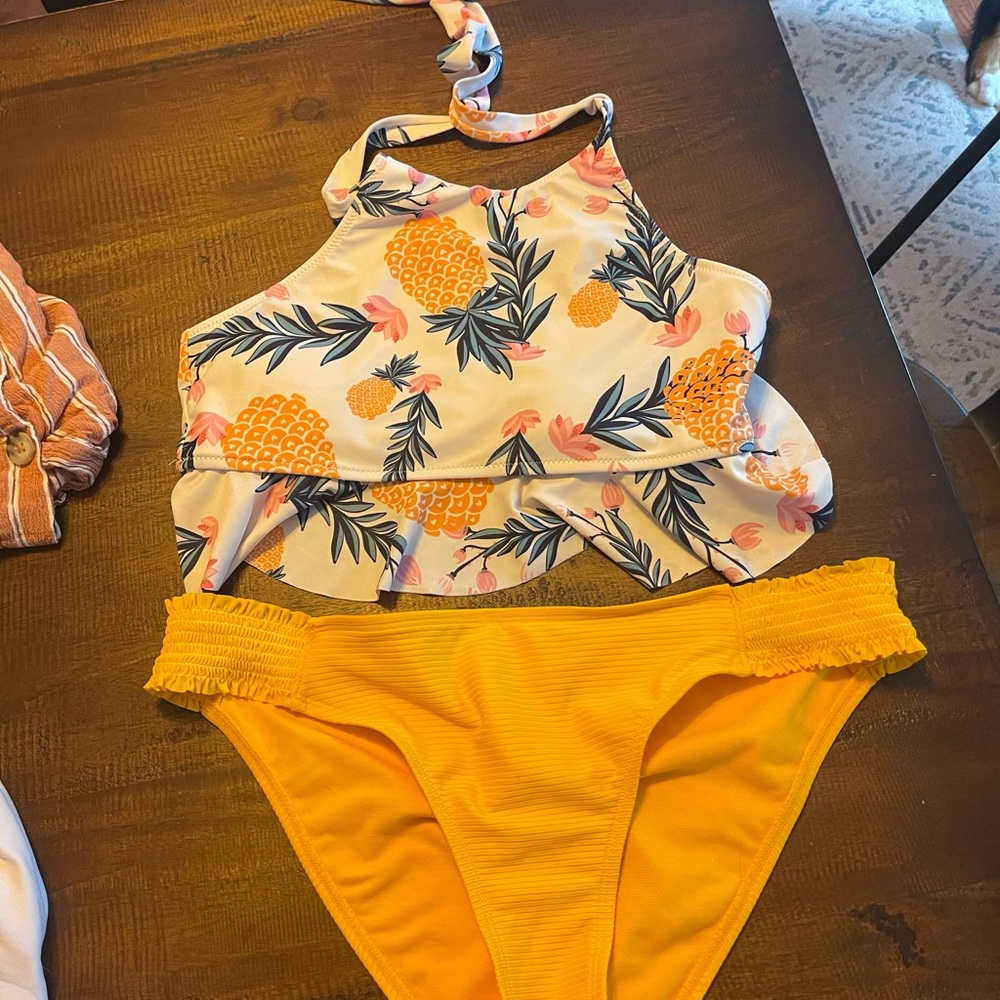 Size large, extra cute bikini with flowy top. In excellent used condition.